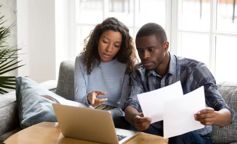 the couple looks at the screen